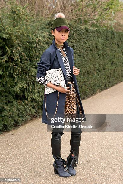 Blogger Margaret Zhang wears a Whistles Coat, bag, top and skirt, Preston and Olivia hat, Tibi shoes, River Island trousers and ManiaMania necklace...