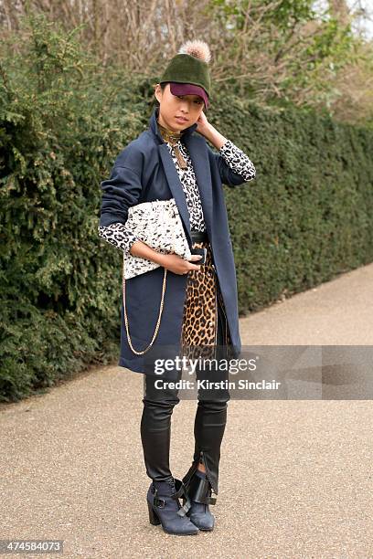 Blogger Margaret Zhang wears a Whistles Coat, bag, top and skirt, Preston and Olivia hat, Tibi shoes, River Island trousers and ManiaMania necklace...