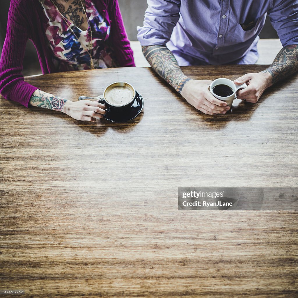 Modern Couple At Coffee Shop