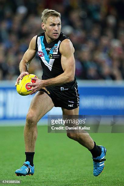 Kane Cornes of the Power kicks the ball during the round eight AFL match between the Port Adelaide Power and the Richmond Tigers at Adelaide Oval on...