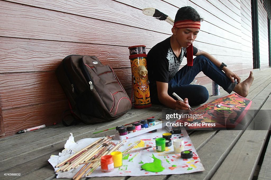 The craftsman of Dayak competing to curve and paint shields...