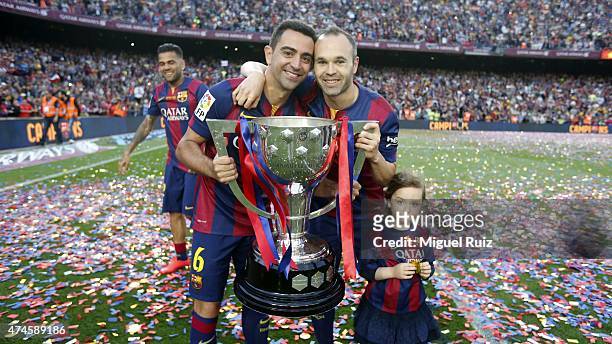 Xavi Hernandez and Andres Iniesta of FC Barcelona pose with La Liga trophy during the La Liga match between FC Barcelona and RC Deportivo La Coruña...