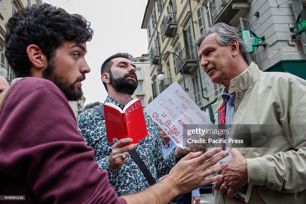 A gay couple arguing with one of the Sentinel in protest.