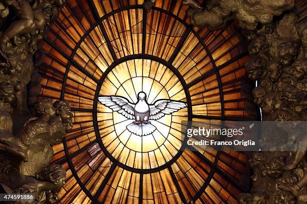 The window overlooking the main altar of St. Peter's Basilica featuring the Holy Spirit during the Pentecost Celebration presided by Pope Francis on...