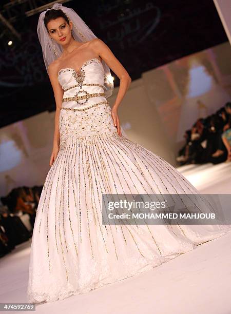 Model presents a creation by Lebanese designer Fadi Nahle during the 2011 Muscat Fashion Week in the Omani capital late on February 23, 2011. AFP...