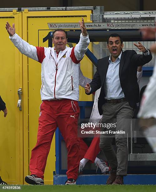 Huub Stevens, head coach of Stuttgart and Robin Dutt, sports director of Stuttgart react during the Bundesliga match between SC Paderborn 07 and VfB...