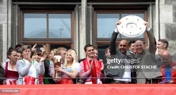 Spanish headcoach of German first division Bundesliga football club FC Bayern Munich Pep Guardiola and sport director Matthias Sammer hold the trophy...