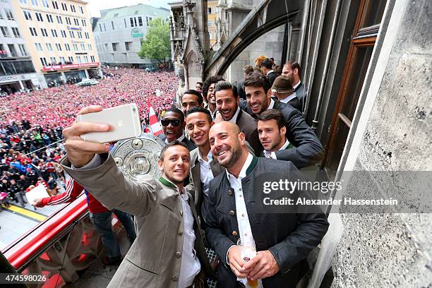 Rafinha of Bayern Muenchen and his team mates David Alaba, Medhi Benatia, Tiago, Dante, Pepe Reina, Claudio Pizarro, Javier Martinez and Juan Bernat...