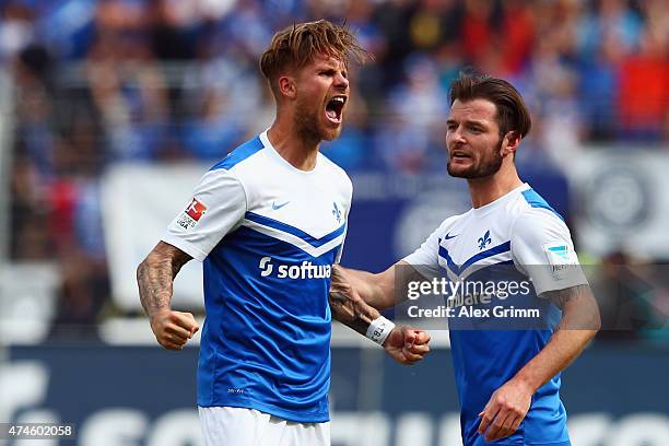 Tobias Kempe of Darmstadt celebrates his team's first goal with team mate Marcel Heller during the Second Bundesliga match between SV Darmstadt 98...