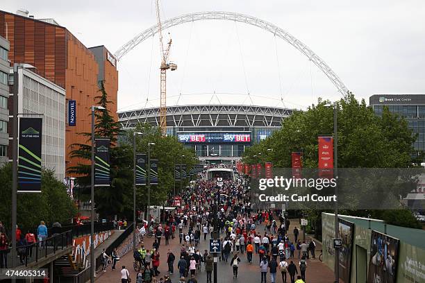 Fans walk to the League One play-off final between Preston North End and Swindon Town at Wembley Stadium on May 24, 2015 in London, England.