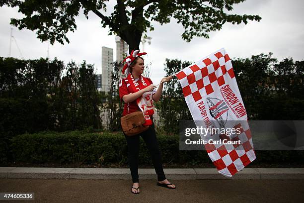 Swindon Town fan waves a flag ahead of the League One play-off final between Preston North End and Swindon Town at Wembley Stadium on May 24, 2015 in...