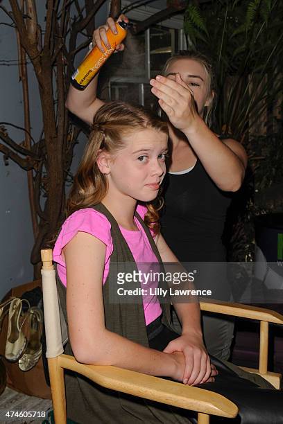 Actress Delaney Raye gets her hair done backstage at The SAP - The Starving Artists Project on May 23, 2015 in Los Angeles, California.