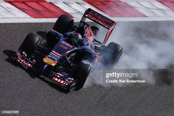 Jean-Eric Vergne of France and Scuderia Toro Rosso locks up as he drives during day two of Formula One Winter Testing at the Bahrain International...