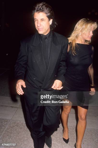 Producer Jon Peters and actress Pamela Anderson attend the "Glory" Century City Premiere on December 11, 1989 at the Cineplex Odeon Century Plaza...
