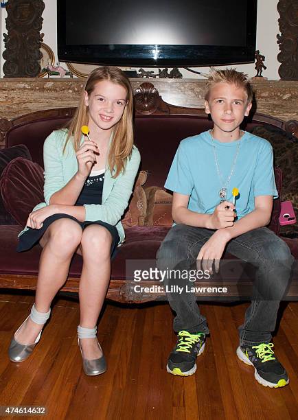 Actors Delaney Raye and Xander Russell enjoy Zollipops at The SAP - The Starving Artists Project - Backstage on May 23, 2015 in Los Angeles,...