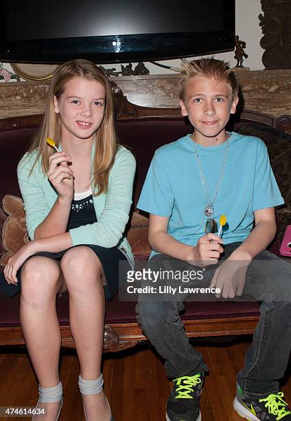 Actors Delaney Raye and Xander Russell enjoy Zollipops at The SAP - The Starving Artists Project - Backstage on May 23, 2015 in Los Angeles,...