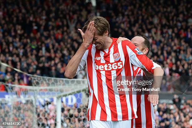 Peter Crouch of Stoke City celebrates scoring his team's sixth goal wduring the Barclays Premier League match between Stoke City and Liverpool at...