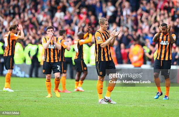 Michael Dawson and Hull City players applaud supporters after relegated from the Premier League during the Barclays Premier League match between Hull...