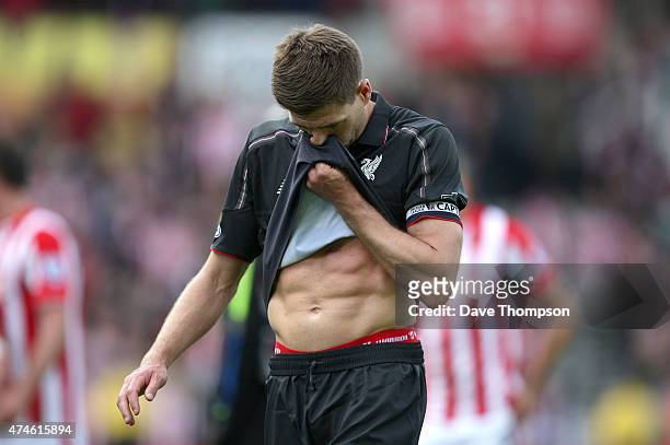 Steven Gerrard of Liverpool reacts after the Barclays Premier League match between Stoke City and Liverpool at Britannia Stadium on May 24, 2015 in...
