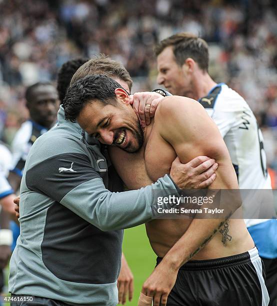 Jonas Guiterrez of Newcastle celebrates with Head Coach John Carver after scoring Newcastles second goal during the Barclays Premier League match...