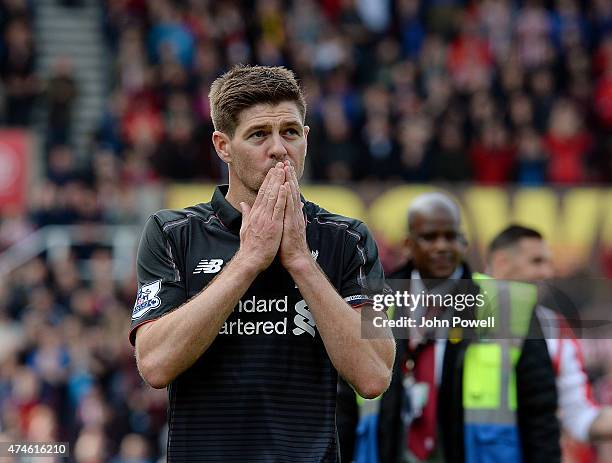 Steven Gerrard of Liverpool shows his appreciation to the fans at the end of the Barclays Premier League match between Stoke City and Liverpool at...