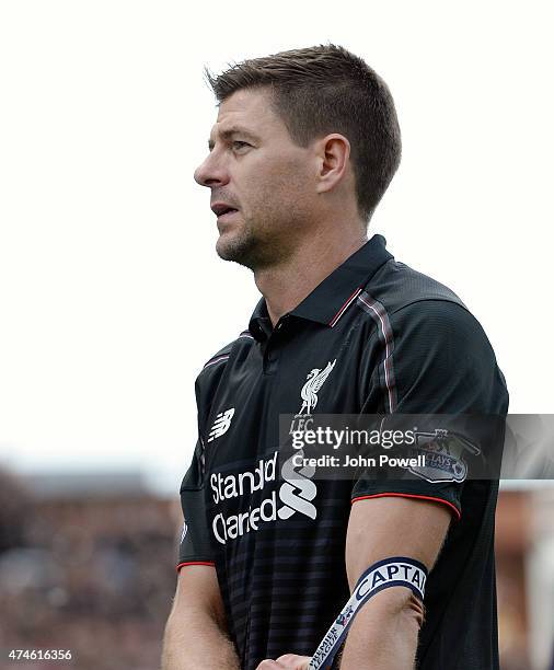 Steven Gerrard of Liverpool takes his captains armband off for the last time during the Barclays Premier League match between Stoke City and...