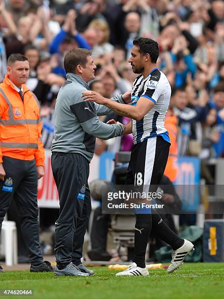 John Carver manager of Newcastle United and Jonas Gutierrez of Newcastle United shake hands after the Barclays Premier League match between Newcastle...