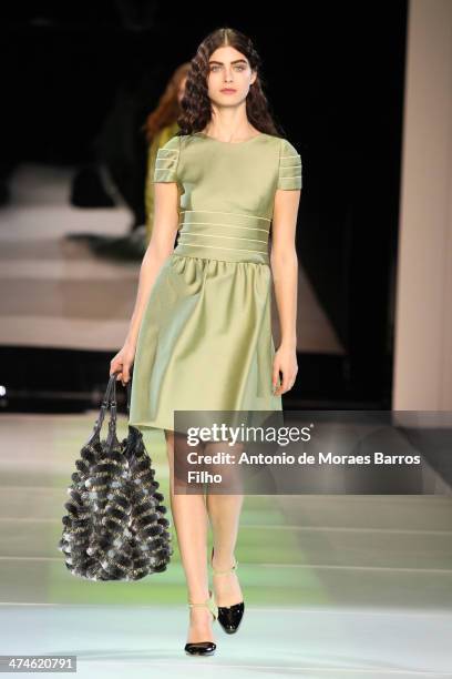 Model walks the runway during the Giorgio Armani show as a part of Milan Fashion Week Womenswear Autumn/Winter 2014 on February 24, 2014 in Milan,...