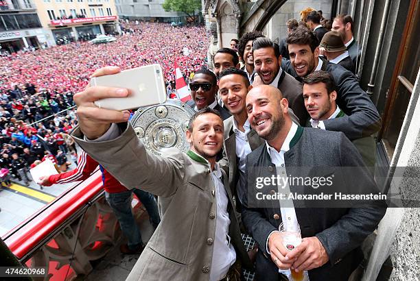 Rafinha of Bayern Muenchen and his team mates David Alaba, Medhi Benatia, Tiago, Dante, Pepe Reina, Claudio Pizarro, Javier Martinez and Juan Bernat...