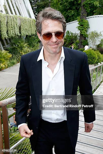 Actor Hugh Grant attends the 2015 Roland Garros French Tennis Open at Roland Garros on May 24, 2015 in Paris, France.
