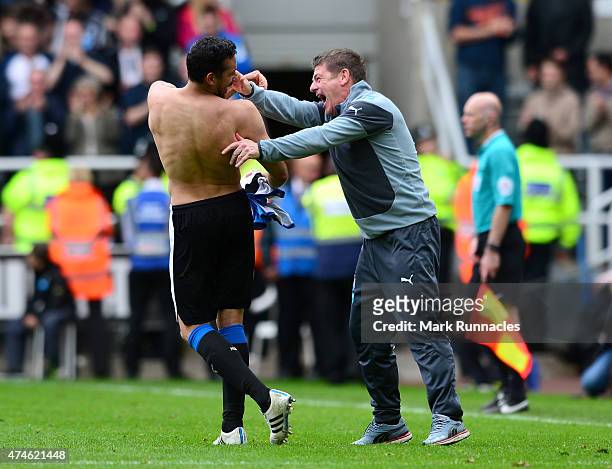 Newcastle United manager John Carver celebrates with goal scorer Jonas Gutierrez during the Barclays Premier League match between Newcastle United...