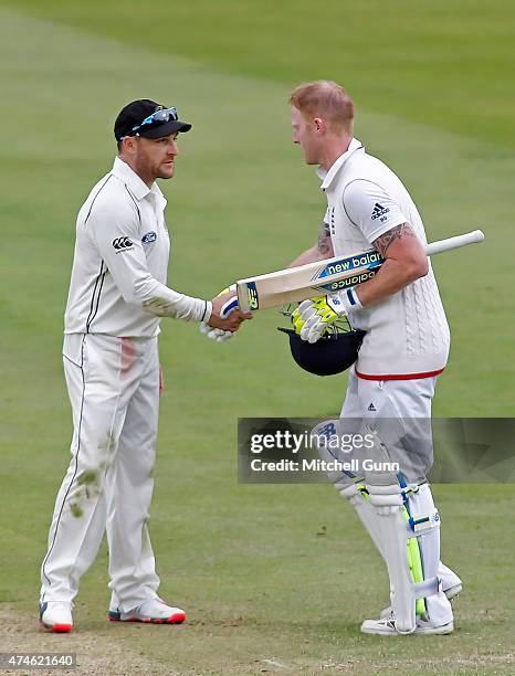 Brendon McCullum of New Zealand shakes hands with Ben Stokes of England as he celebrates scoring a century during day four of the 1st Investec Test...