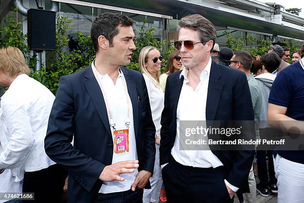 Maus Freres International / Lacoste, Thierry Guibert and Actor Hugh Grant attend the 2015 Roland Garros French Tennis Open at Roland Garros on May...