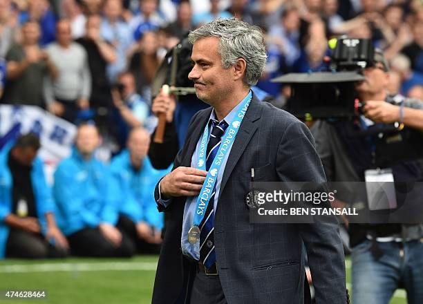 Chelsea's Portuguese manager Jose Mourinho wears his winners' medal following the Premier League trophy presentation after the English Premier League...