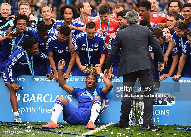 Didier Drogba wears a crown during their Premier League title celebration after the Barclays Premier League match between Chelsea and Sunderland at...