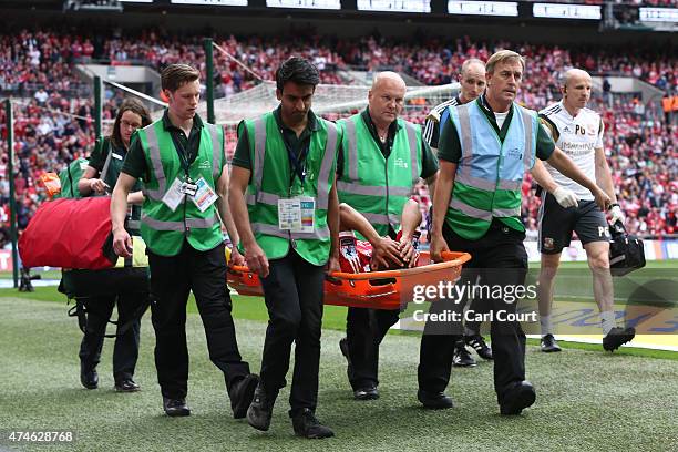 Nathan Thompson of Swindon Town is stretchered off during the League One play-off final between Preston North End and Swindon Town at Wembley Stadium...