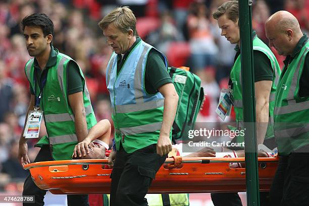 Nathan Thompson of Swindon Town is stretchered off during the League One play-off final between Preston North End and Swindon Town at Wembley Stadium...