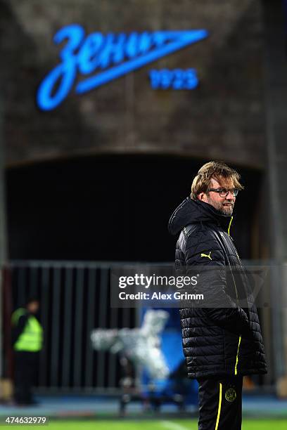 Head coach Juergen Klopp of Dortmund looks on during a training session ahead of the UEFA Champions League Round of 16 first leg match between FC...