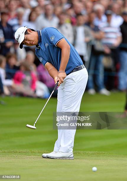 Korean golfer Byeong Hun An putts on the 18th green on his way to winning the PGA Championship at Wentworth Golf Club in Surrey, south west of London...