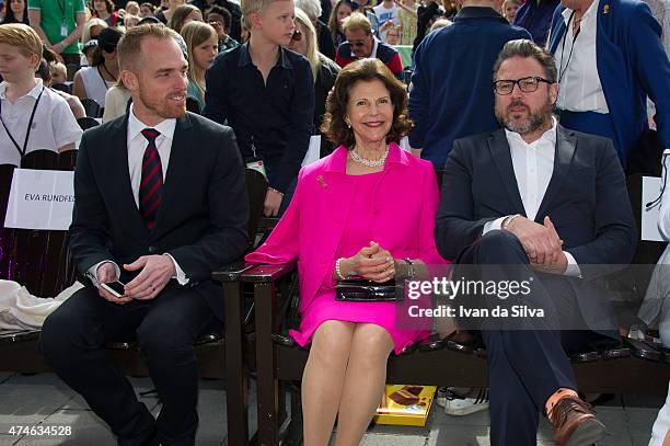 Chief Executive Officer Chister Fogelmarck, Queen Silvia of Sweden, CEO Grona Lund Magnus Widell attends The Childhood Day in Stockholm on May 24,...