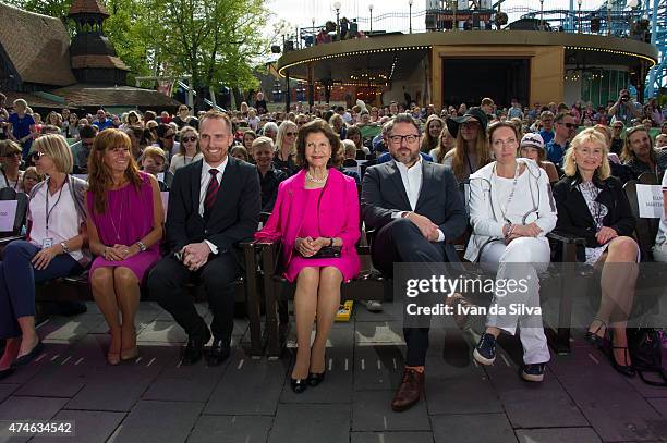 Chief Executive Officer Chister Fogelmarck, Queen Silvia of Sweden, CEO Grona Lund Magnus Widell attends The Childhood Day in Stockholm on May 24,...