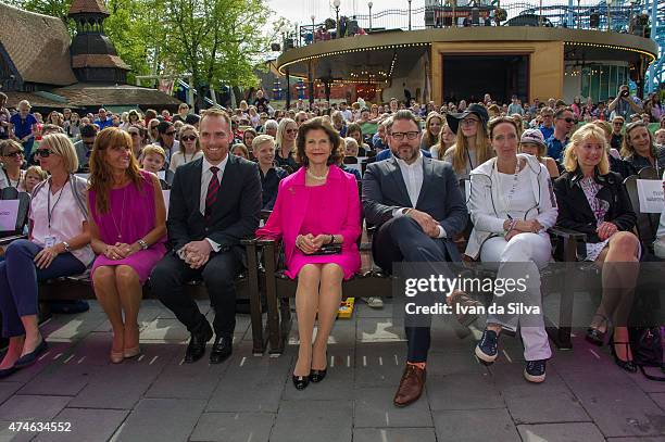 Chief Executive Officer Chister Fogelmarck, Queen Silvia of Sweden, CEO Grona Lund Magnus Widell attends The Childhood Day in Stockholm on May 24,...