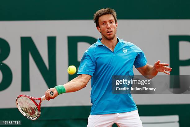 Igor Sijsling of Netherlands plays a forehand in his Men's Singles match against Ernests Gulbis of Latvia on day one of the 2015 French Open at...