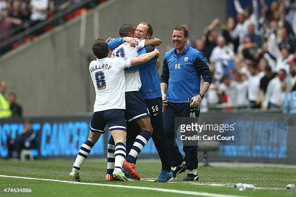 Jermaine Beckford of Preston North End celebrates with manager Simon Grayson after scoring during the League One play-off final between Preston North...