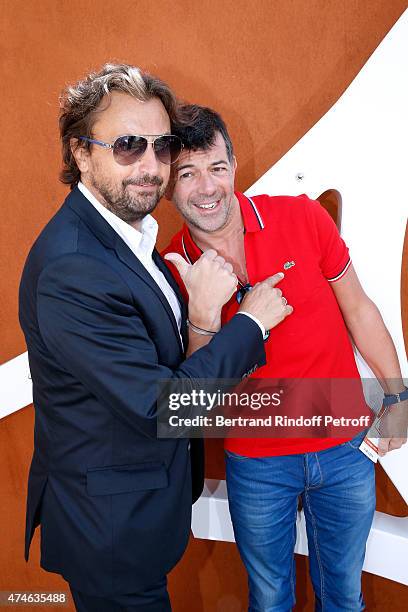 Henri Leconte and TV Host Stephane Plaza attend the 2015 Roland Garros French Tennis Open at Roland Garros on May 24, 2015 in Paris, France.