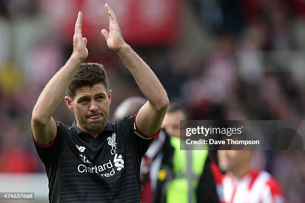 Steven Gerrard of Liverpool applauds the fans after the Barclays Premier League match between Stoke City and Liverpool at Britannia Stadium on May...