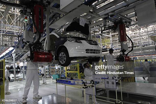 The assembly line of the Honda Amaze car is pictured inside the company's manufacturing plant at Tapukara on February 24, 2014 in Alwar, India. The...