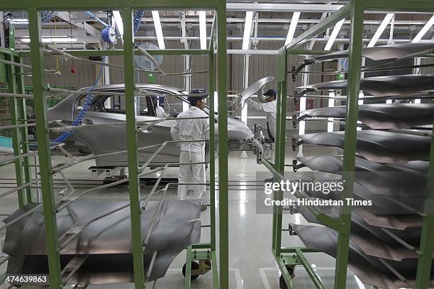 The assembly line of the Honda Amaze car is pictured inside the company's manufacturing plant at Tapukara on February 24, 2014 in Alwar, India. The...