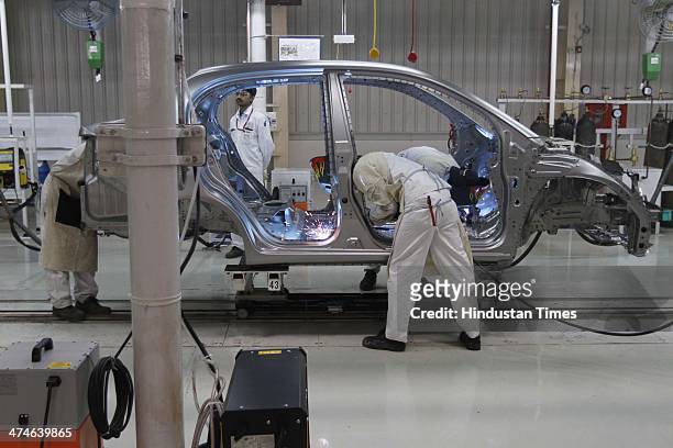 The assembly line of the Honda Amaze car is pictured inside the company's manufacturing plant at Tapukara on February 24, 2014 in Alwar, India. The...