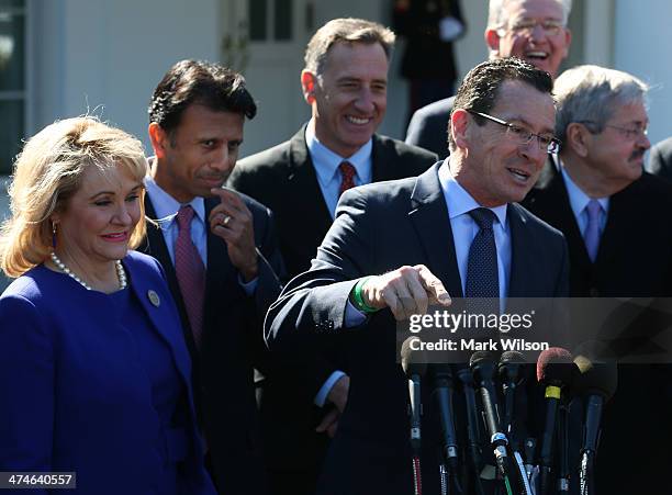 Connecticut Gov. Dan Malloy speaks while flanked by Gov. Mary Fallin, , Gov. Bobby Jindal , and other members of the National Governors Association,...